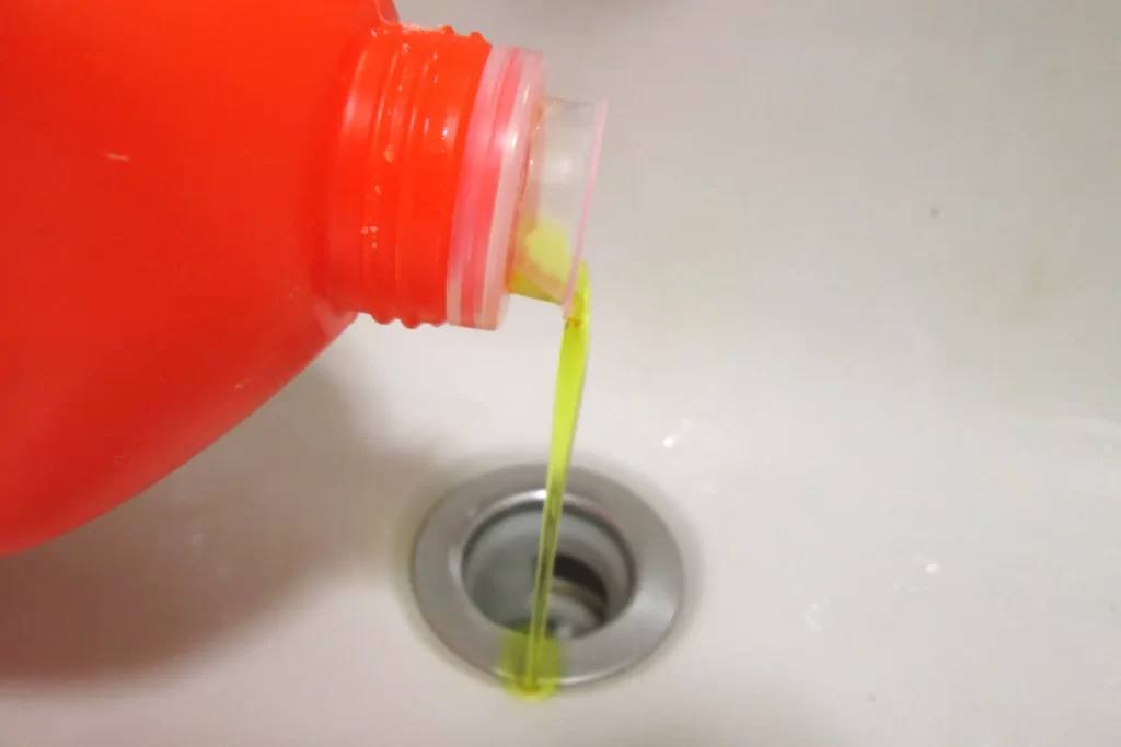 Multi-purpose cleaner poured into a drain