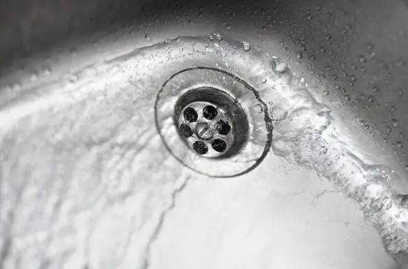 swirl water going down sink